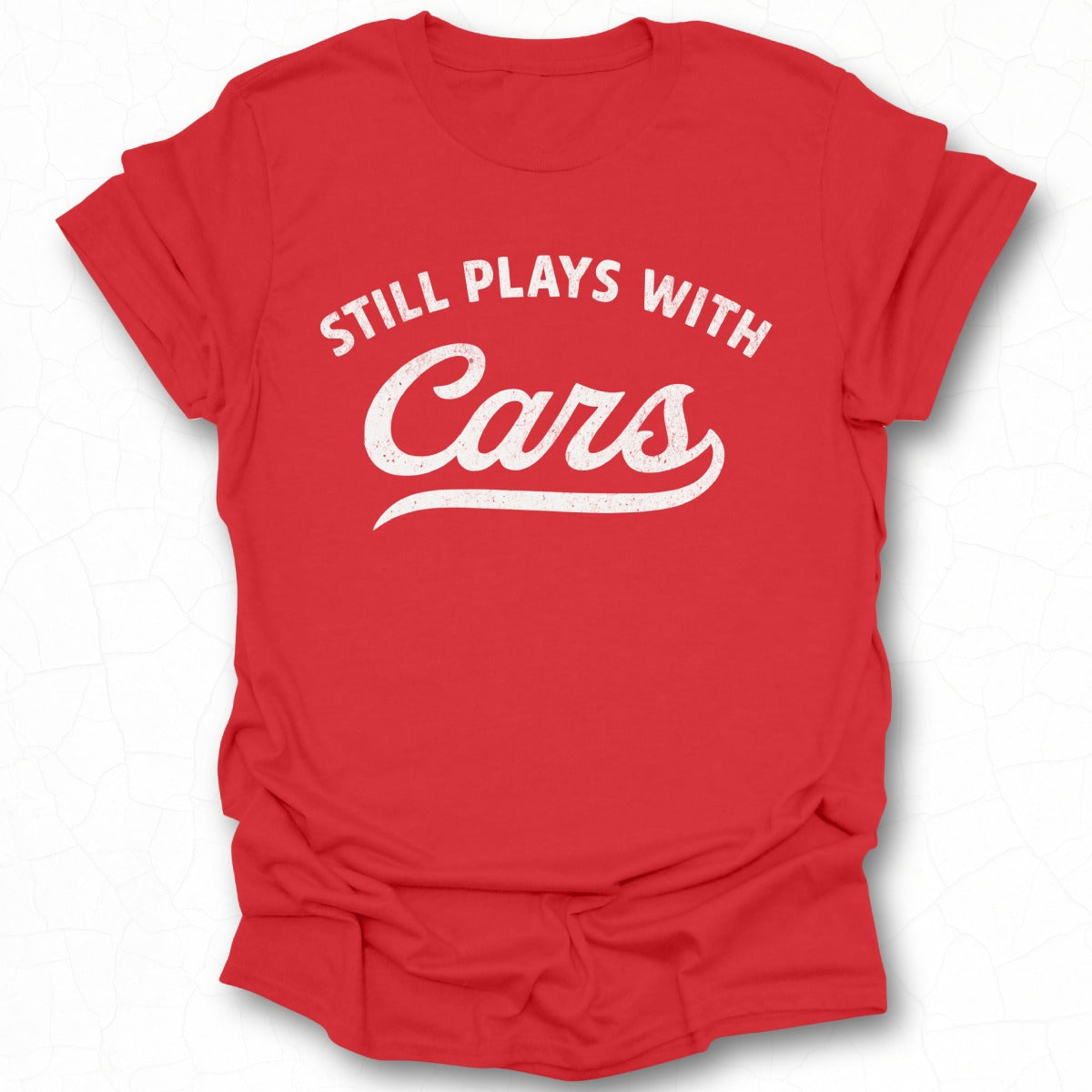 Still Plays With Cars Humorous T-Shirt Product