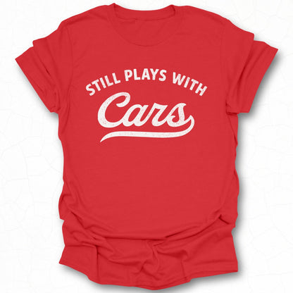 Still Plays With Cars Humorous T-Shirt Product